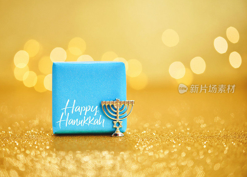 Hanukkah background with Hanukkah gift and small menorah